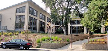 a black car parked in front of a building
